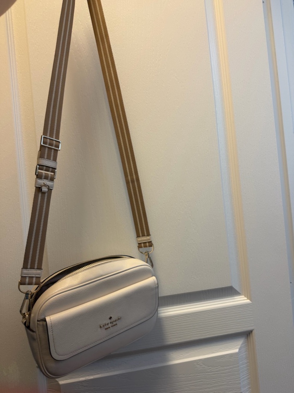 kate spade cream pebble leather crossbody with tan-striped strap